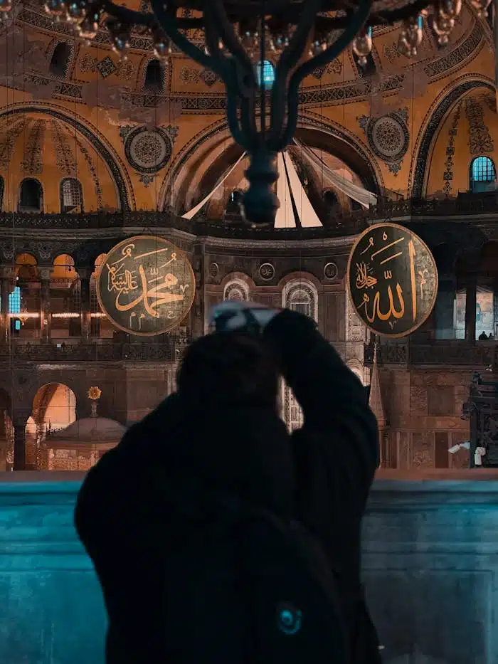 A photographer captures the stunning interior of the Hagia Sophia, showcasing its intricate Islamic and Byzantine architecture.
