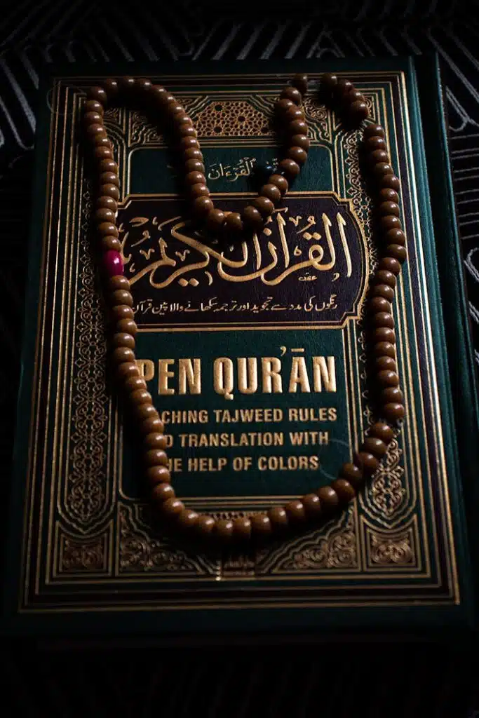 Intricate design of a Quran with prayer beads, symbolizing Islamic faith and spirituality.